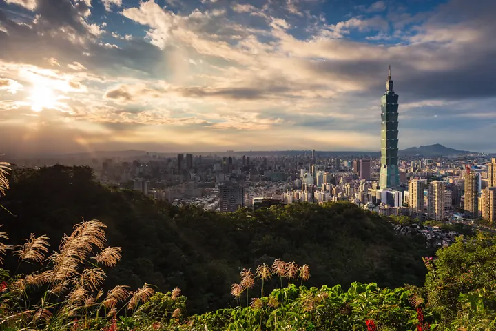 Taipei 101 rising above the city at sunset