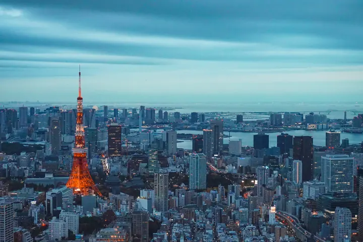 Tokyo Tower illuminated above the Tokyo skyline at dusk