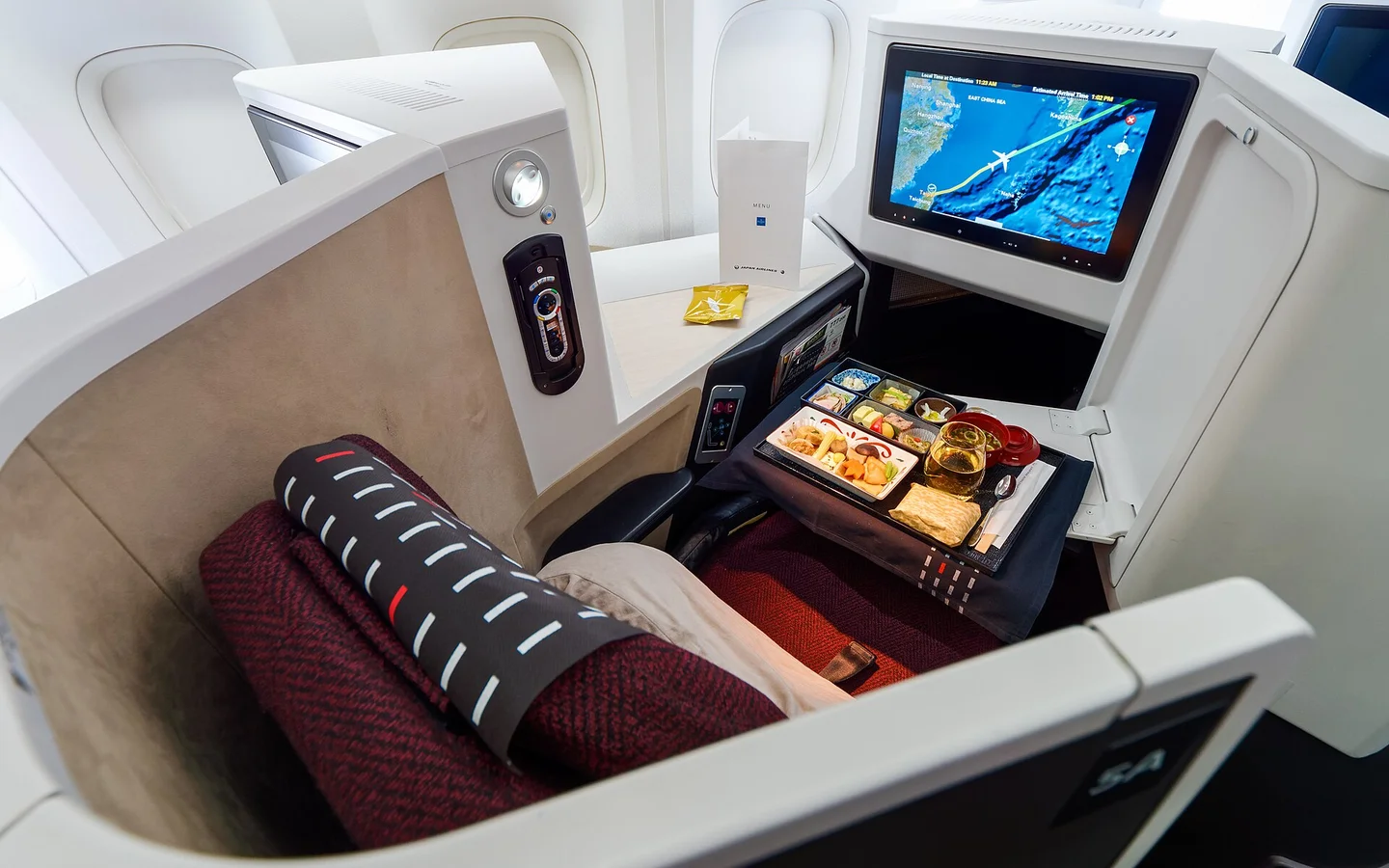 Japan Airlines business class seat and dining setup